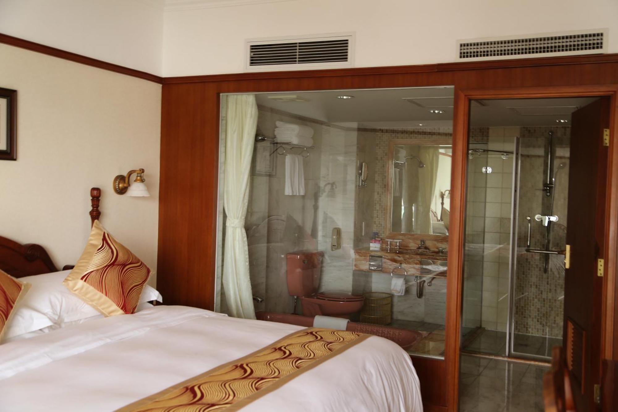 Huiquan Dynasty Hotel צ'ינגדאו חדר תמונה